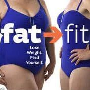 A woman in blue bathing suit standing next to a sign that says " fat > fit ".